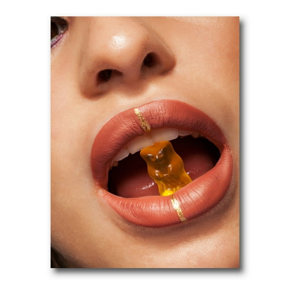 Designart ' Close Up VIew of Female Lips Biting Gummy Bear ' Modern Canvas Wall Art Print