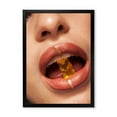 thumbnail image 1 of Designart 'Close Up VIew of Female Lips Biting Gummy Bear' Modern Framed Art Print, 1 of 4