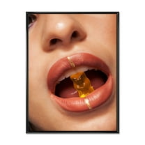Designart 'Close Up VIew of Female Lips Biting Gummy Bear' Modern Framed Canvas Wall Art Print