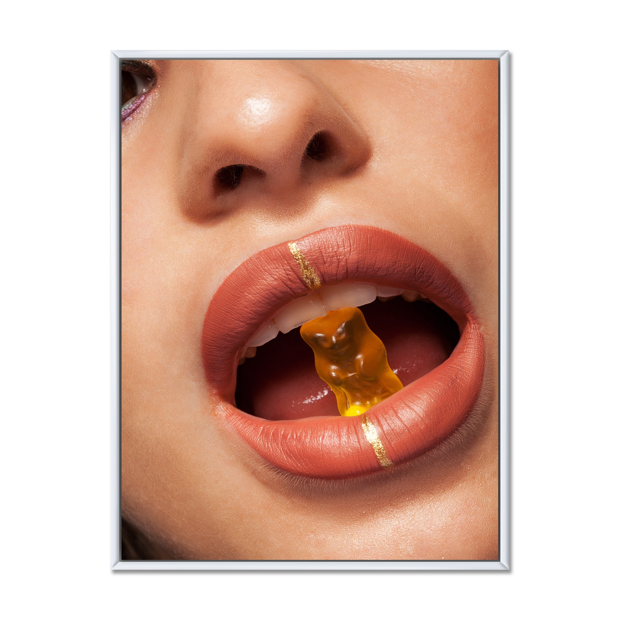Designart 'Close Up VIew of Female Lips Biting Gummy Bear' Modern Framed Canvas Wall Art Print