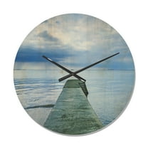 Designart 'Concrete Lake Pier Under Cloudy Sky ' Modern Wood Wall Clock