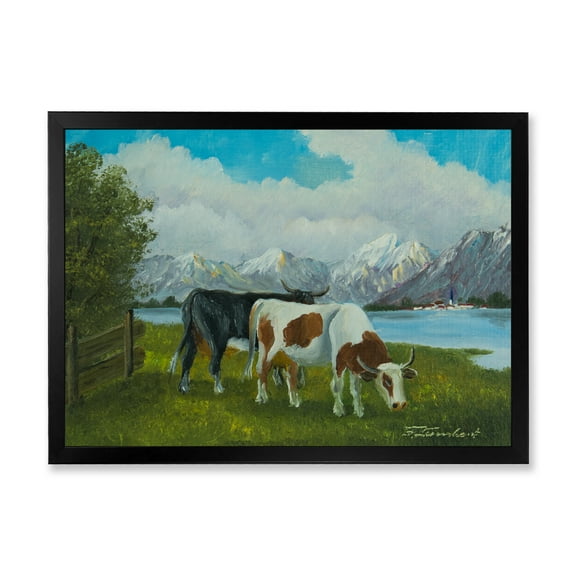 Designart 'Cows Eating Grass In Front Of A Lake' Farmhouse Framed Art Print