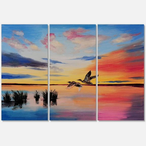 Designart ' Crane Birds Flying During Colorful Sunset ' Nautical & Coastal Canvas Wall Art Print