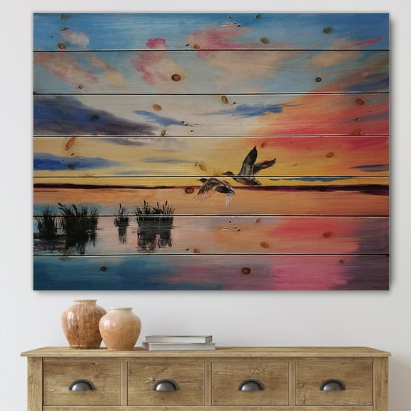 Designart 'Crane Birds Flying During Colorful Sunset' Nautical & Coastal Print on Natural Pine Wood