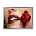 thumbnail image 1 of Designart 'Girl With Red Lipstick Holding A Rose In Mouth' Modern Framed Art Print, 1 of 4
