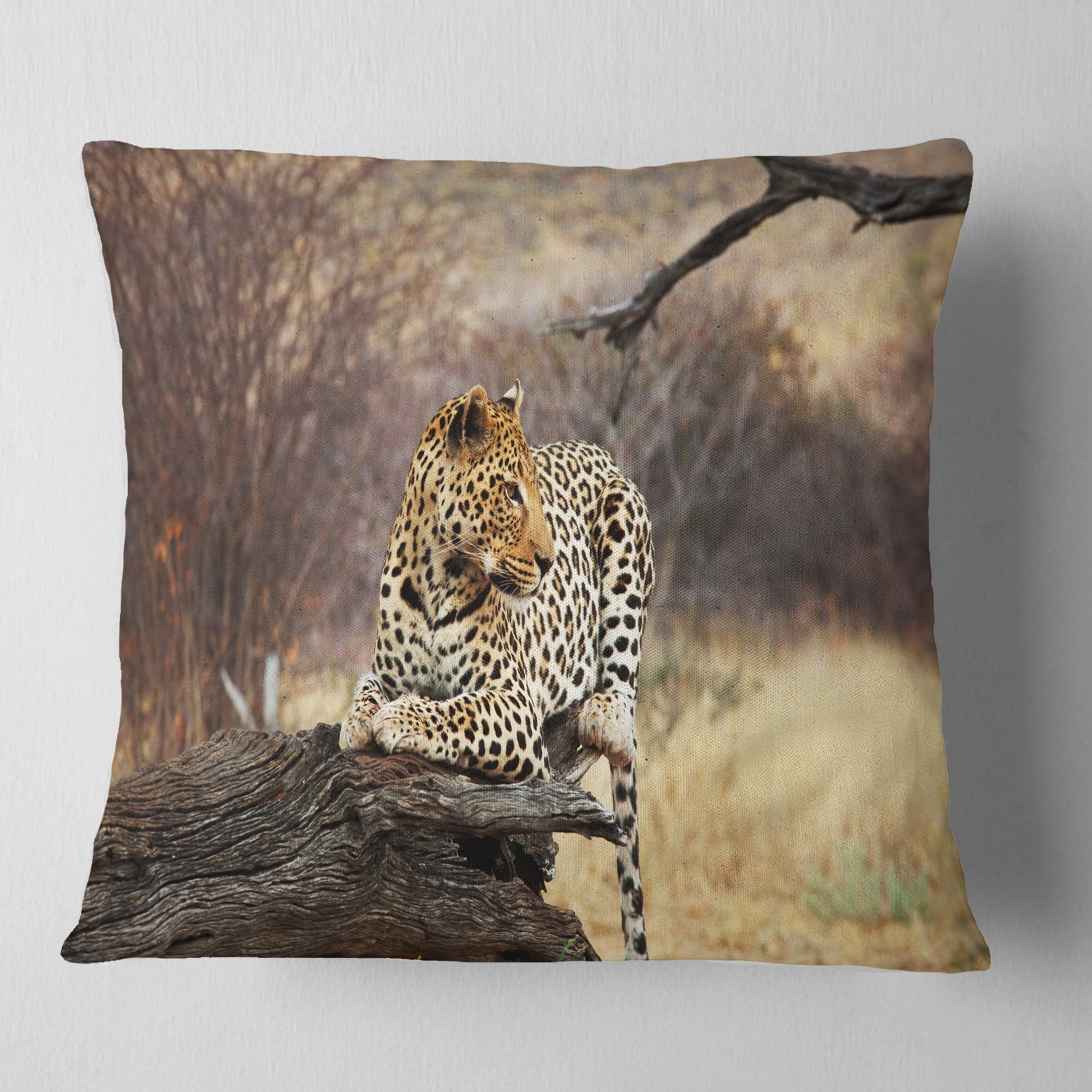 Designart Leopard Sitting on Tree Trunk - African Throw Pillow - 18x18