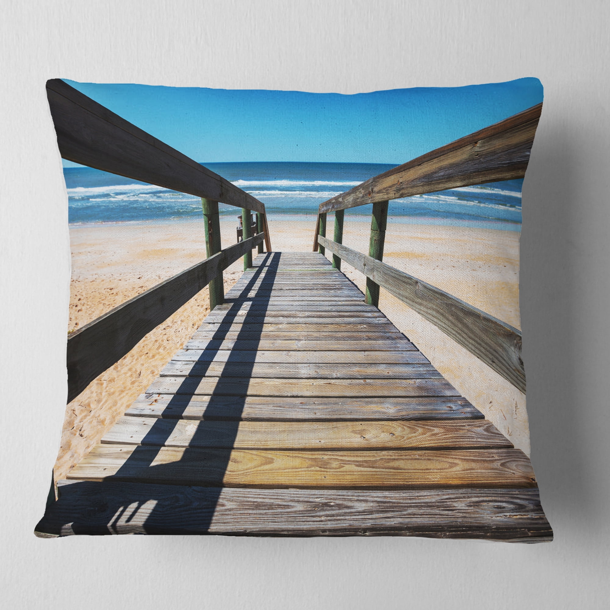 Designart Long Boardwalk into Blue Seashore - Seashore Throw Pillow - 16x16