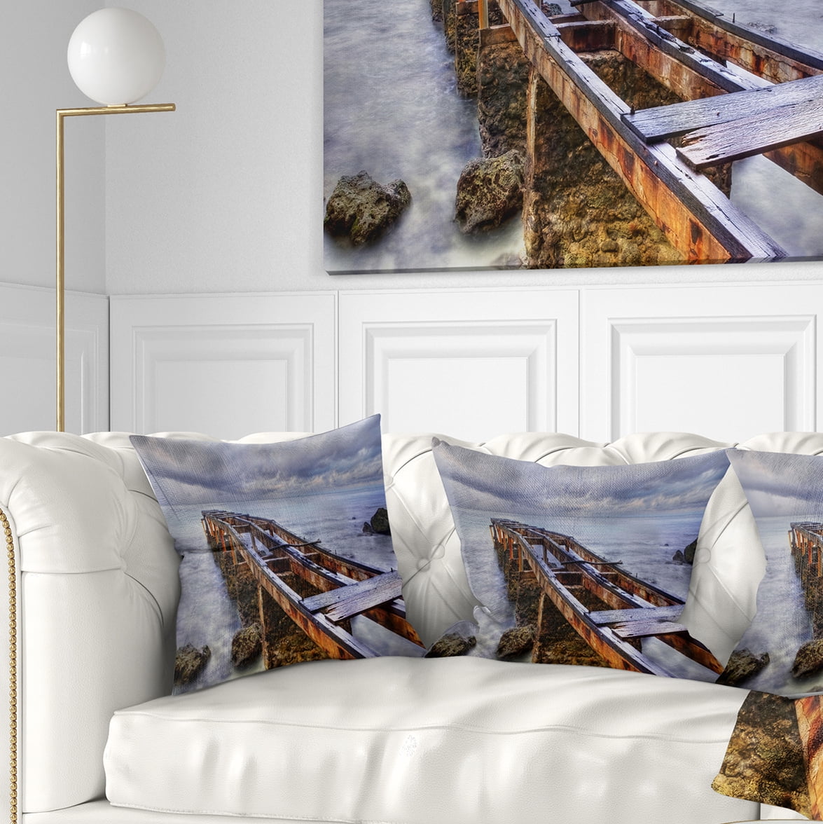 Designart Old Rusty Pier in Cloudy Day - Seashore Photo Throw Pillow - 18x18