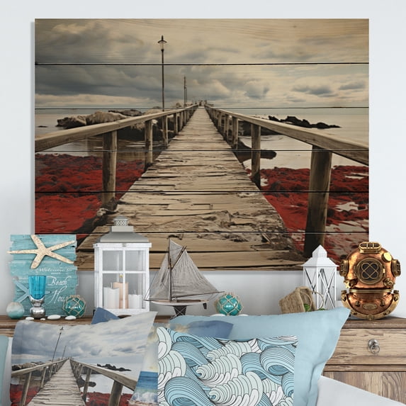 Designart "Perspective Black Beach Pier VII" Nautical & Beach Print on Natural Pine Wood