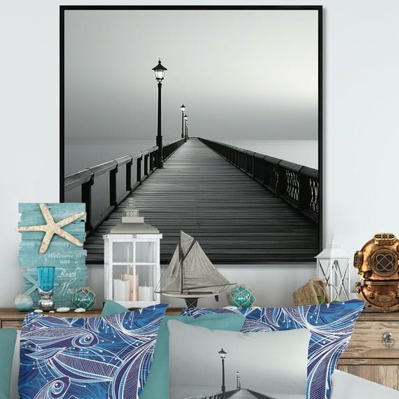 Designart "Pier Horizon In Monochromatic Black And White III" Coastal Pier Floater Framed Canvas Art Print