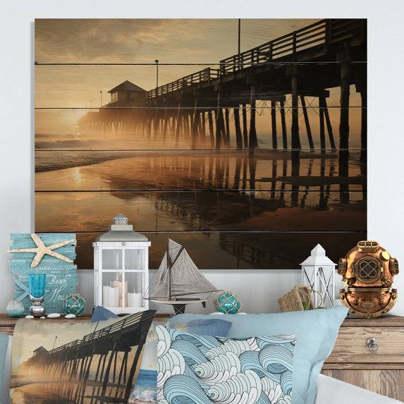 Designart "Pier Reflections Beach Photo IX" Nautical & Beach Print on Natural Pine Wood