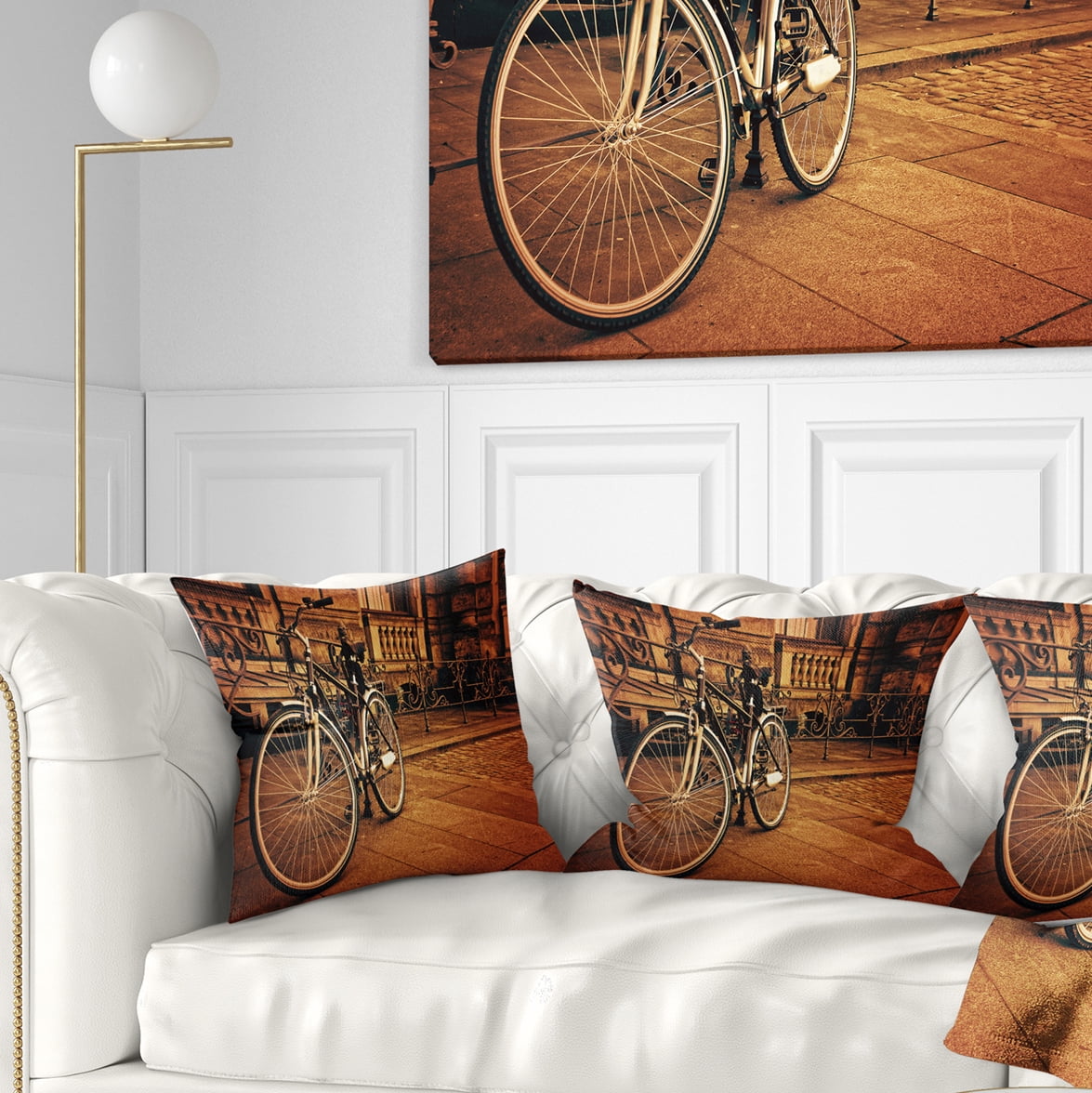 Designart Retro Bicycle against Stone Wall - Landscape Photography Throw Pillow - 16x16