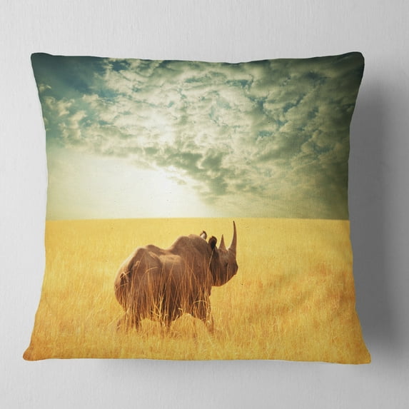 Designart Rhino in Grassland under Cloudy Sky - African Throw Pillow - 16x16