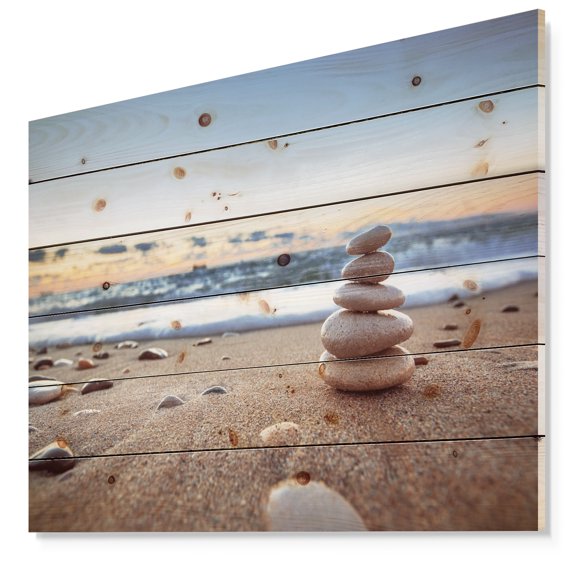 Designart 'Stones Balance on Sandy Beach' Seashore Print on Natural Pine Wood