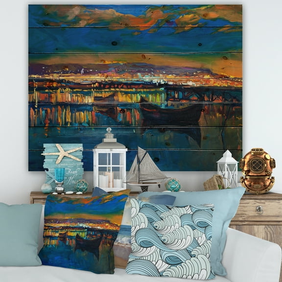 Designart 'Two Little Boats In The VIllage Harbor Ar Night' Nautical & Coastal Print on Natural Pine Wood