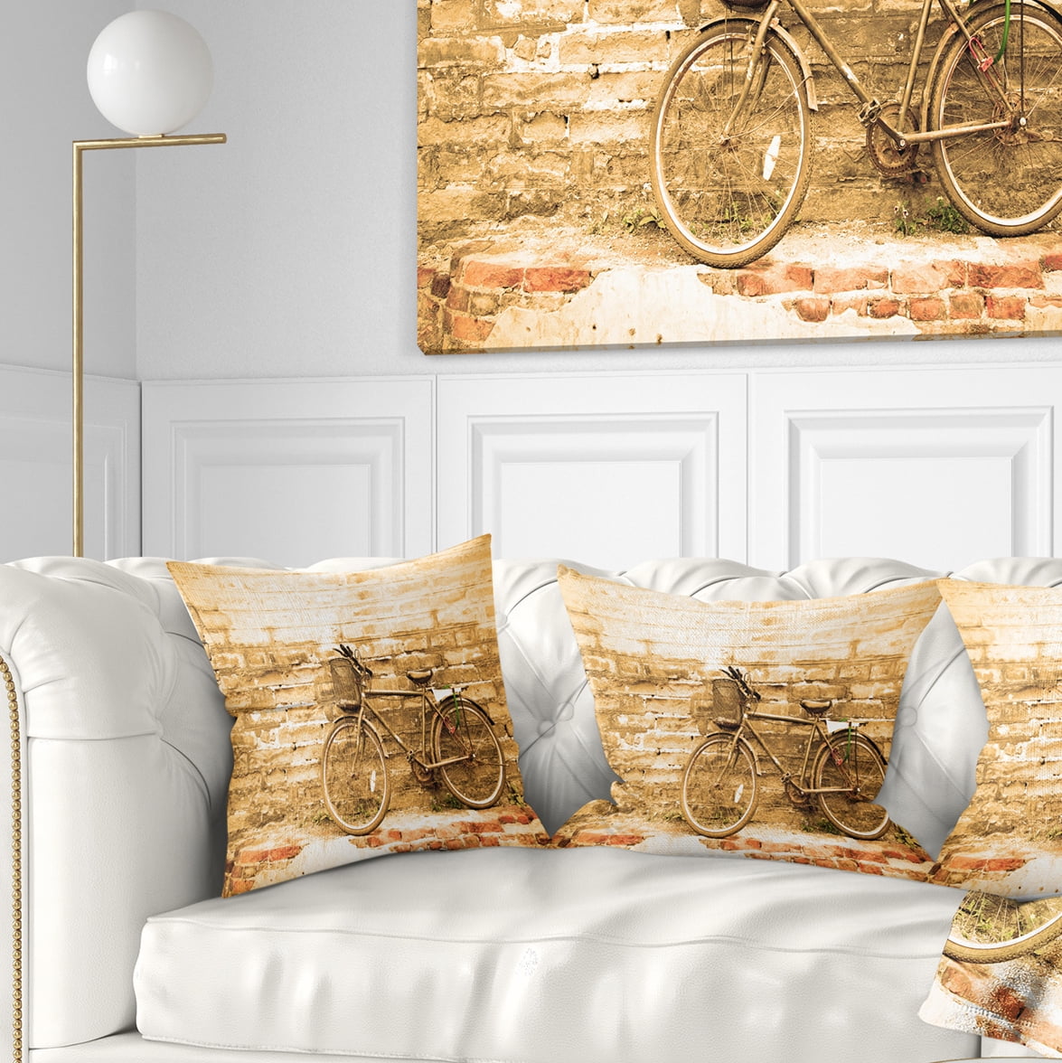 Designart Vintage Bicycle against Brown Wall - Landscape Printed Throw Pillow - 18x18