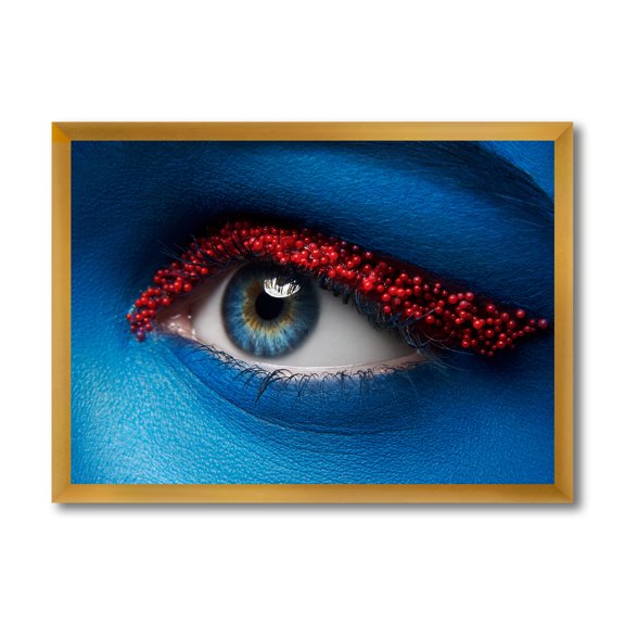 Designart 'Woman Eye With Blue Paint On Face & Red Balls' Modern Framed Art Print