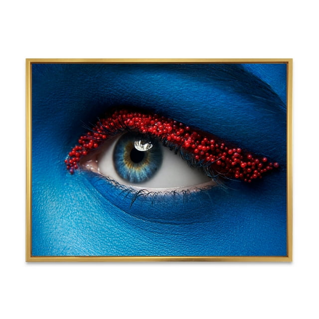 Designart 'Woman Eye With Blue Paint On Face & Red Balls' Modern Framed Canvas Wall Art Print