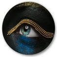 thumbnail image 1 of Designart 'Woman Eyes With Black Skin With A Gold Chain' Modern Circle Metal Wall Art 23x23 - Disc of 23, 1 of 5