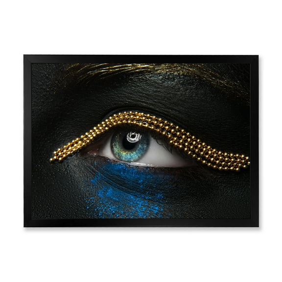 Designart 'Woman Eyes With Black Skin With A Gold Chain' Modern Framed Art Print