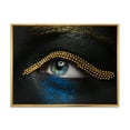 thumbnail image 1 of Designart 'Woman Eyes With Black Skin With A Gold Chain' Modern Framed Canvas Wall Art Print, 1 of 5