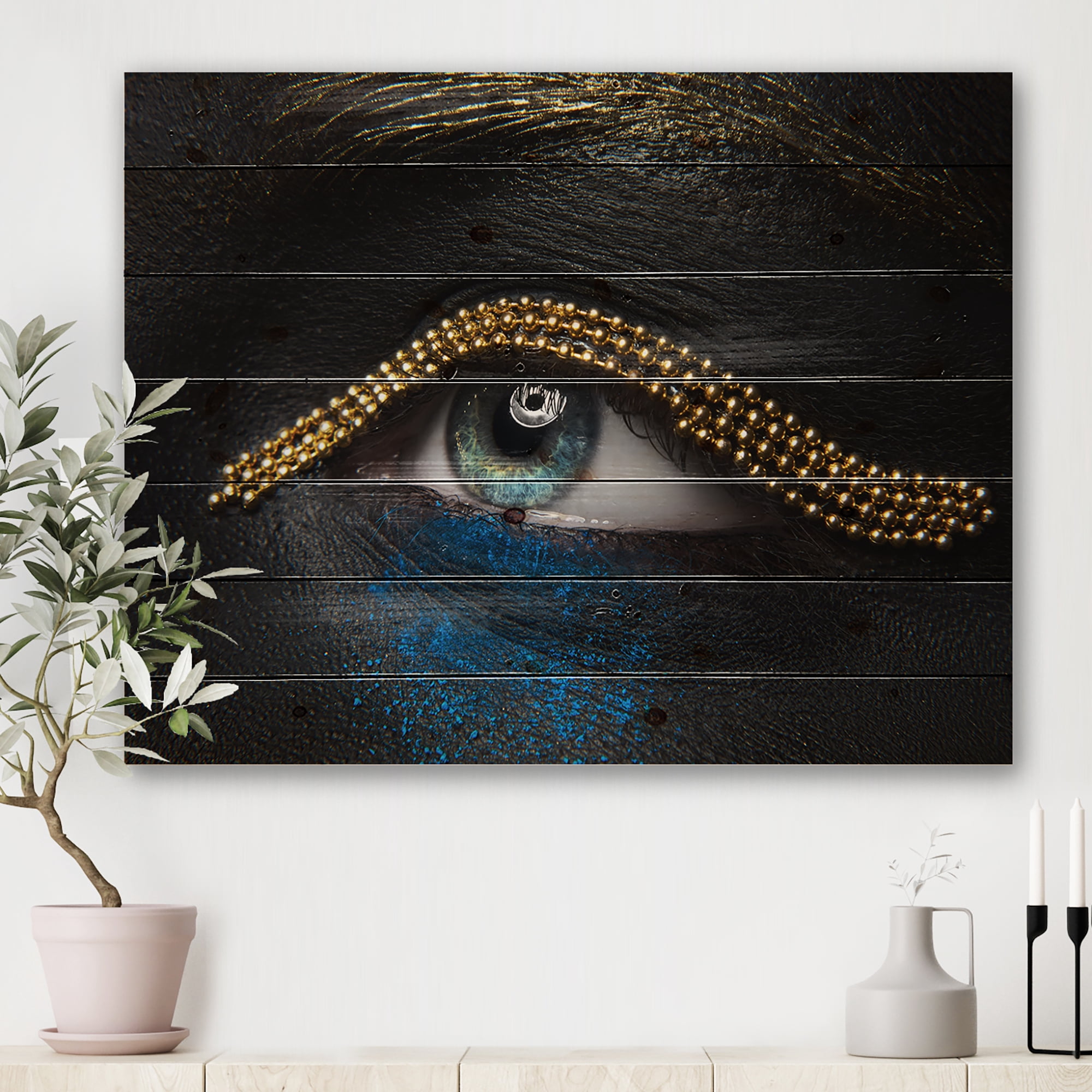 Designart 'Woman Eyes With Black Skin With A Gold Chain' Modern Print on Natural Pine Wood