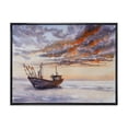 thumbnail image 1 of Designart 'Wooden Fishing Boat On The Baltic Shore With Evening Clouds' Nautical & Coastal Framed Canvas Wall Art Print, 1 of 5