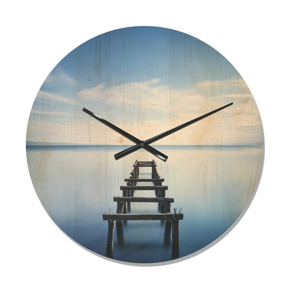 Designart 'Wooden Jetty Remains in Blue Lake ' Modern Wood Wall Clock