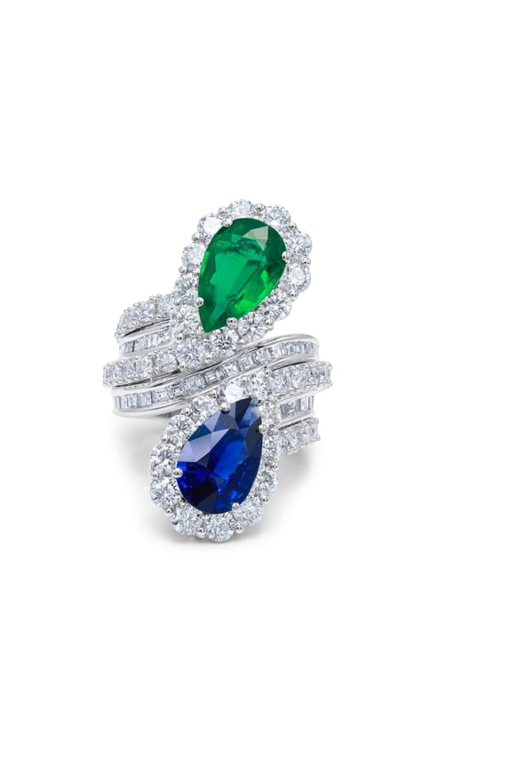 Platinum Sapphire And Emerald Ring With A Spiral Design Featuring A 2.98 Ct Pear Shaped Sapphire And 2.85 Ct Pear Shaped Emerald Surrounded By 6.02 Cts Of Diamonds (C.Dunaigre Certified)