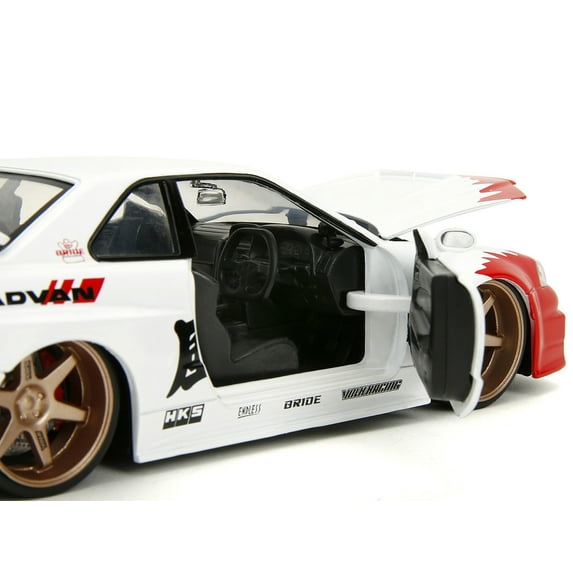 Diecast 2002 Nissan Skyline GT-R (R34) RHD (Right Hand Drive) White with Red Graphics and Ryu Diecast Figure "Street Fighter" Video Game "Anime Hollywood Rides" Series 1/24 Diecast Model Car by Jada