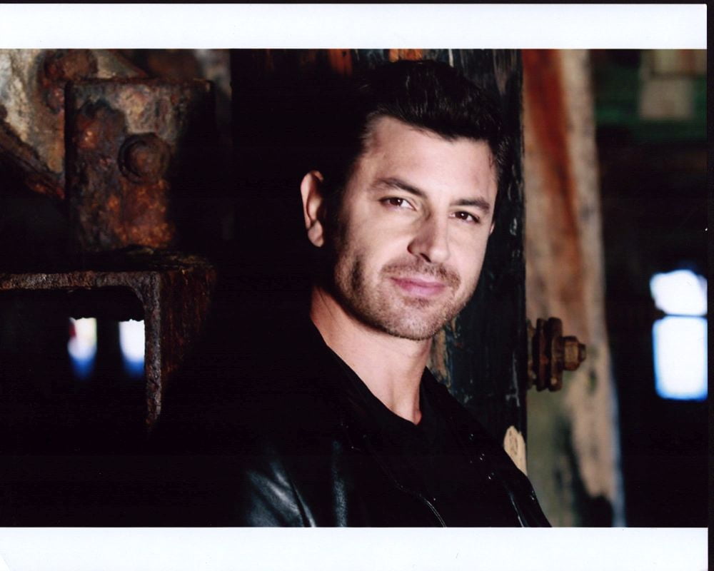 Diego Serrano Leaning On Rusted Wall In Leather Jacket Photo Print (8 x 10) Item MVM01017