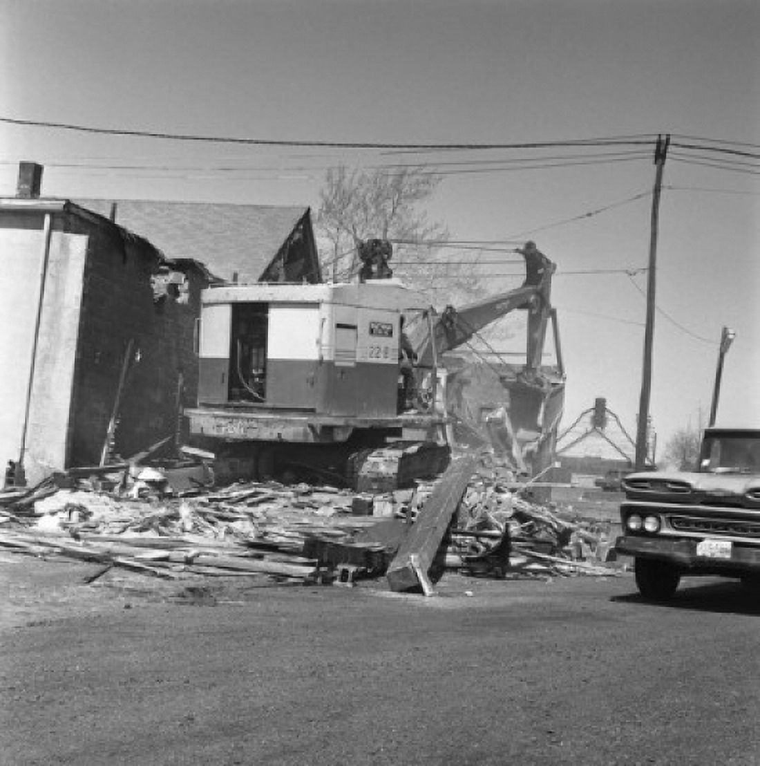 Digger demolishing building Canvas Art - (24 x 36)