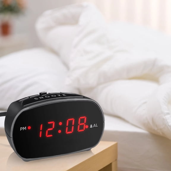 Digital LED alarm clock, adjustable alarm volume, sleep prevention function, compact and lightweight, suitable for bedside and desk use.