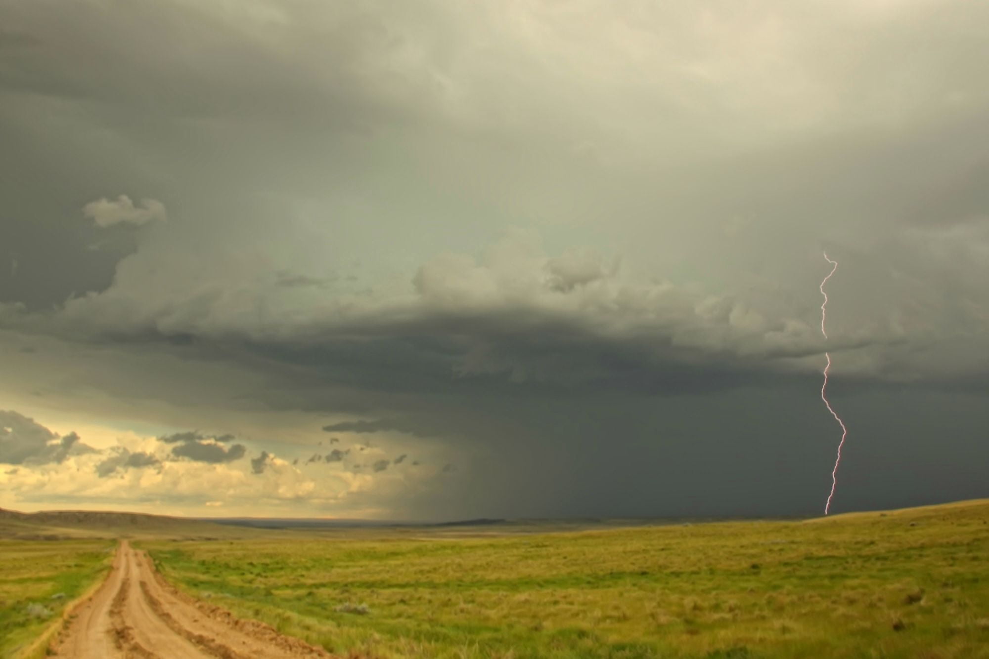 Digitally Enhanced Image With Painterly Effect Of Lightning Striking In Grasslands National Park Saskatchewan Canvas Art - Robert Postma Design Pics (34 x 22)