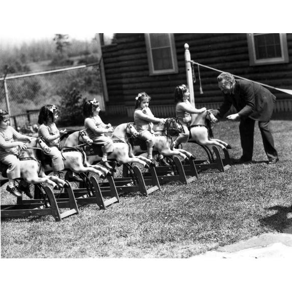 Dionne Quintuplets Playing Carousel in Black and White Photo Print (24 x 30)