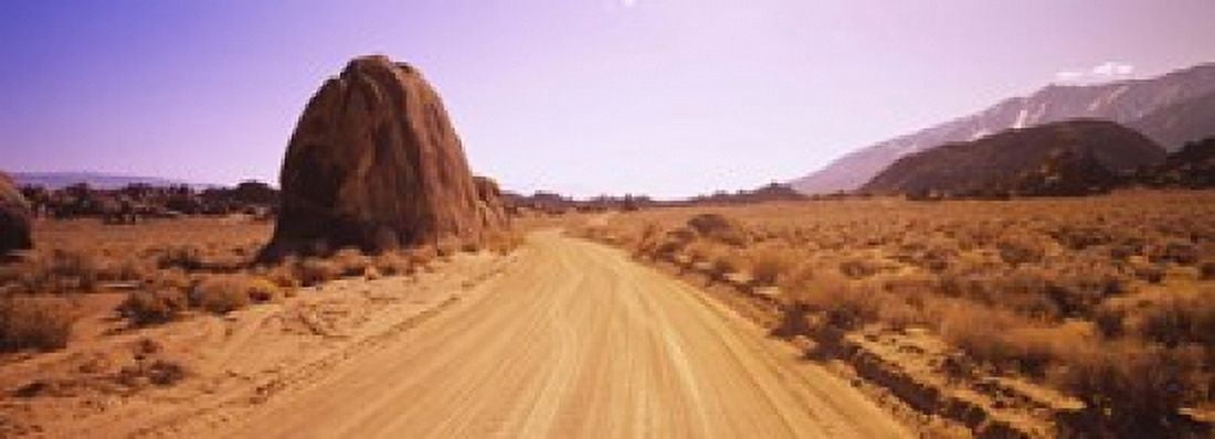 Dirt road passing through an arid landscape Californian Sierra Nevada California USA Canvas Art - Panoramic Images (18 x 7)