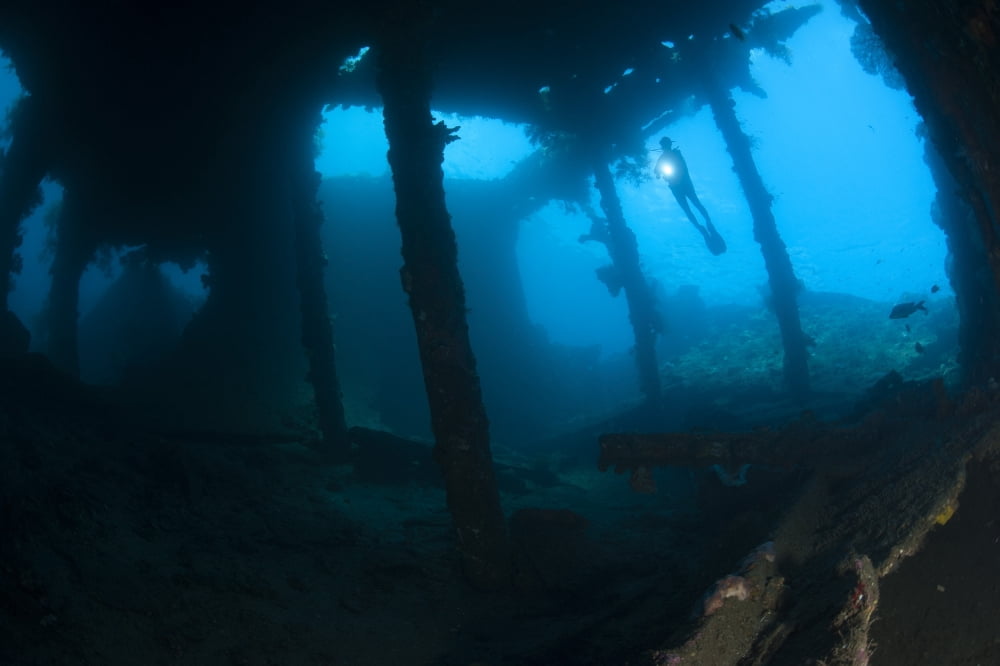 Diver exploring the Liberty Wreck Tulamben Bali Indonesia Canvas Art - Steve JonesStocktrek Images (18 x 12)