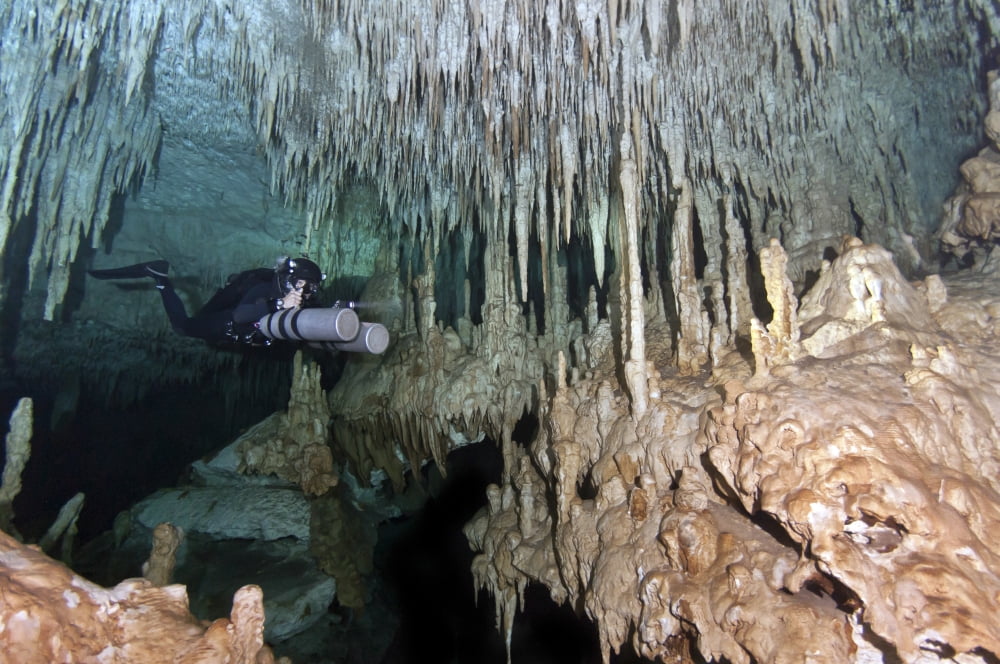 Diver using side mount gear in cave in Mexico Canvas Art - Karen DoodyStocktrek Images (18 x 12)