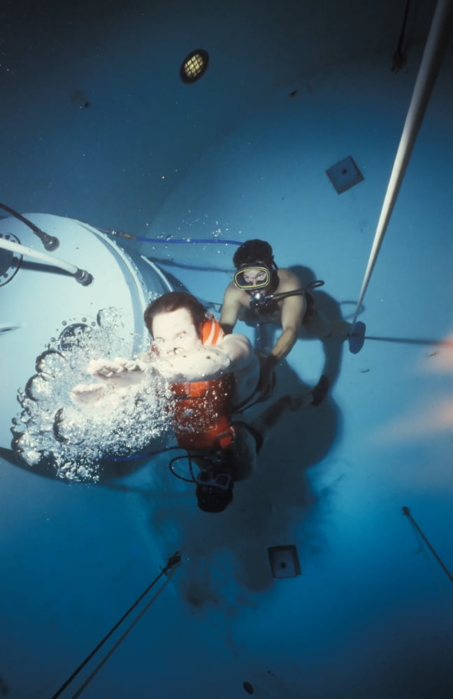 Diving bell instructor releases control of the buoyant ascent student as he begins the rapid ascent to the surface Canvas Art - Michael WoodStocktrek Images (22 x 34)