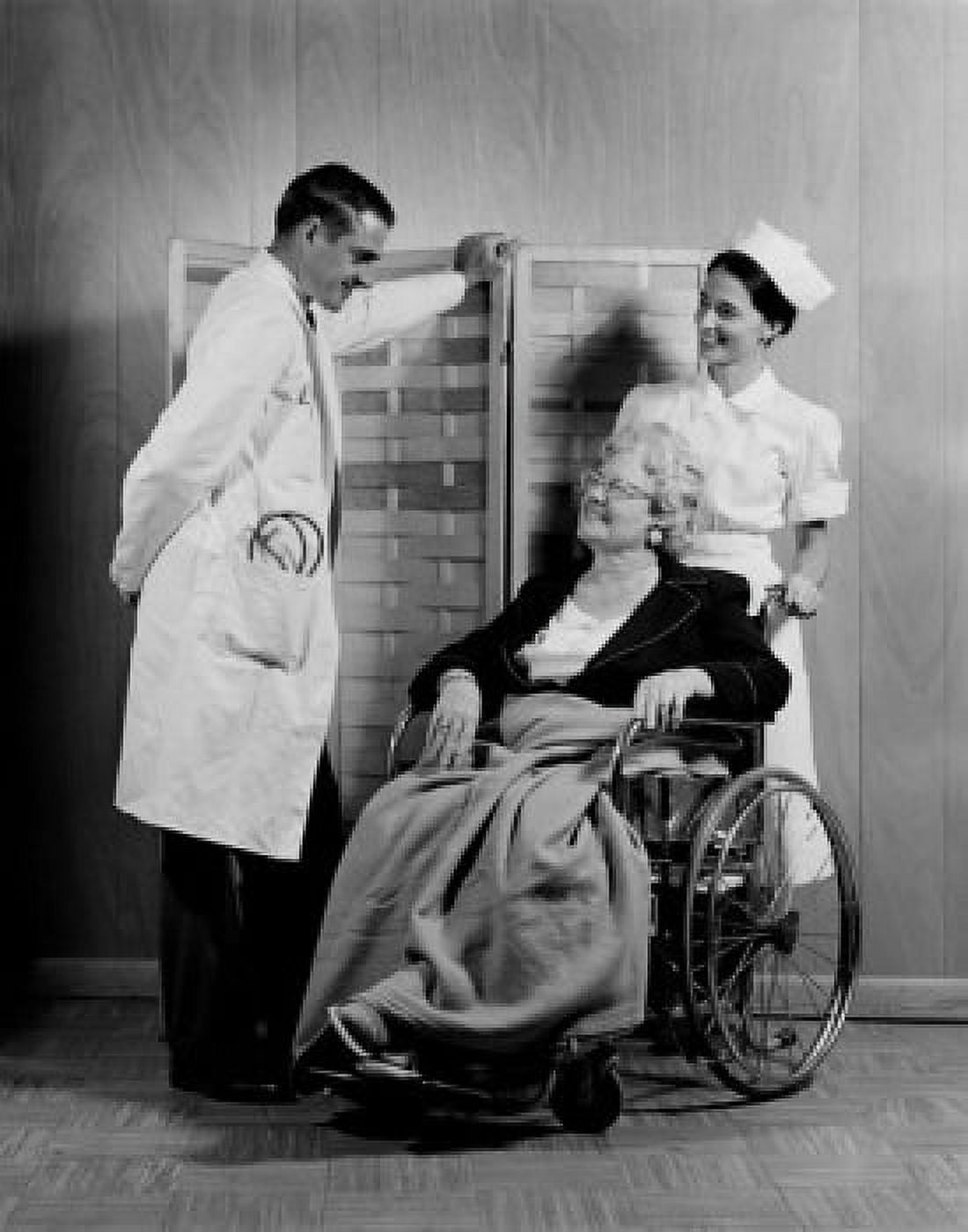Doctor chatting with senior patient in wheel chair Canvas Art - (18 x 24)
