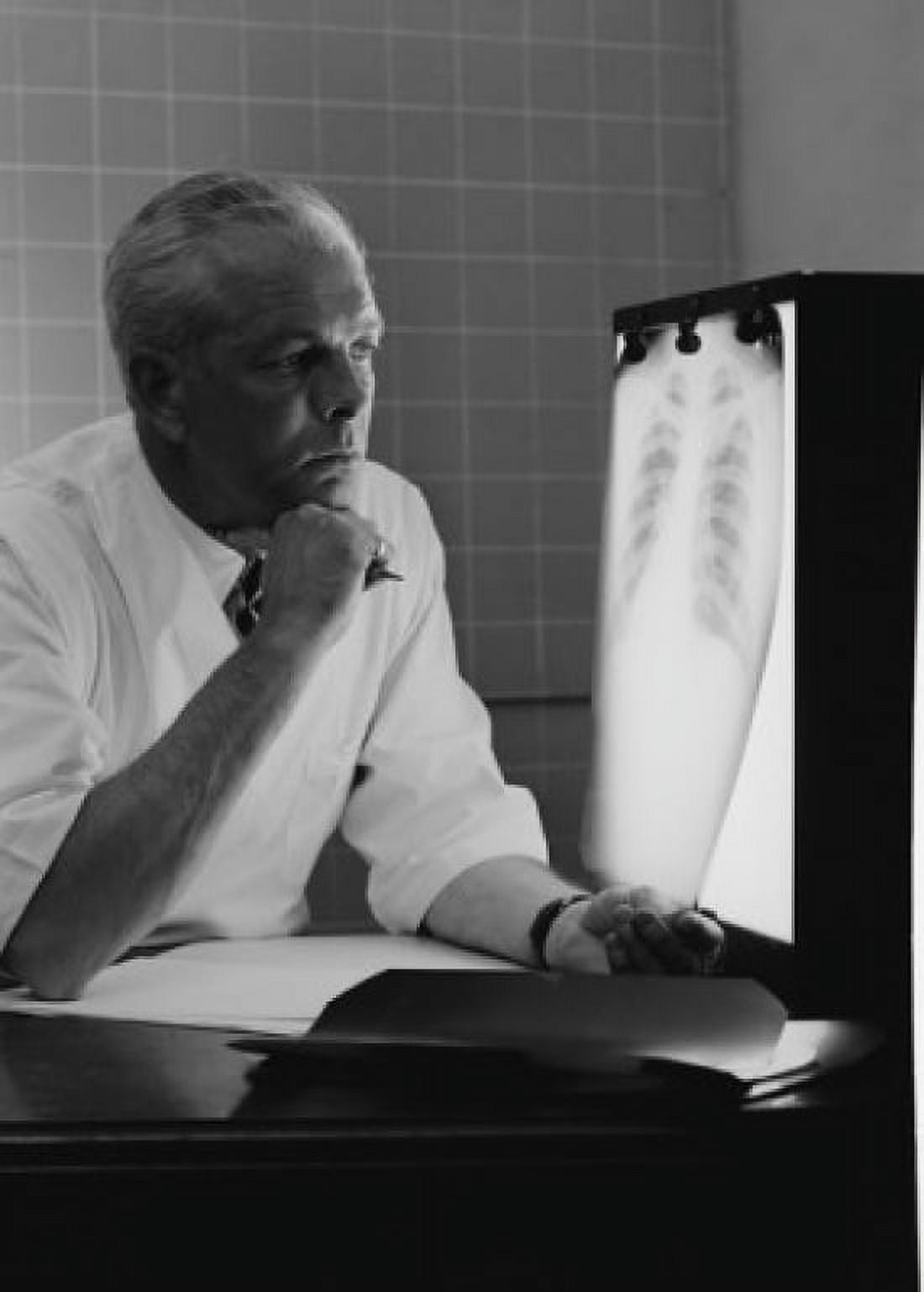 Doctor examining x-ray Canvas Art - (18 x 24)