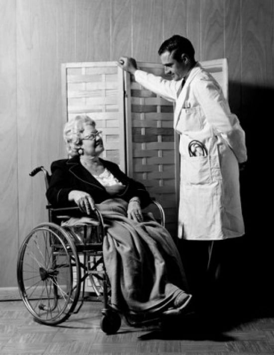 Doctor looking at senior patient in wheelchair Canvas Art - (24 x 36)