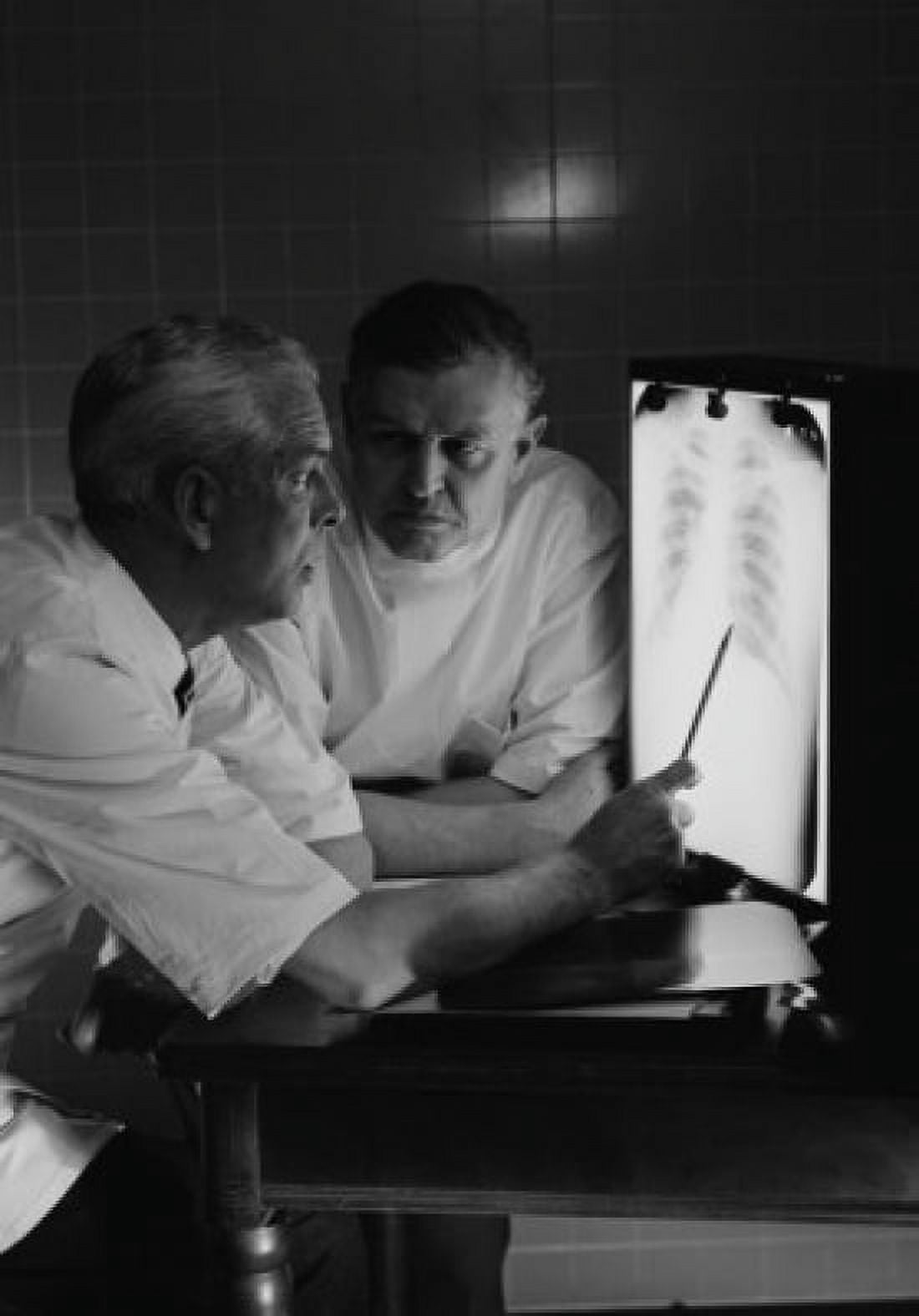 Doctors examining x-ray Canvas Art - (24 x 36)