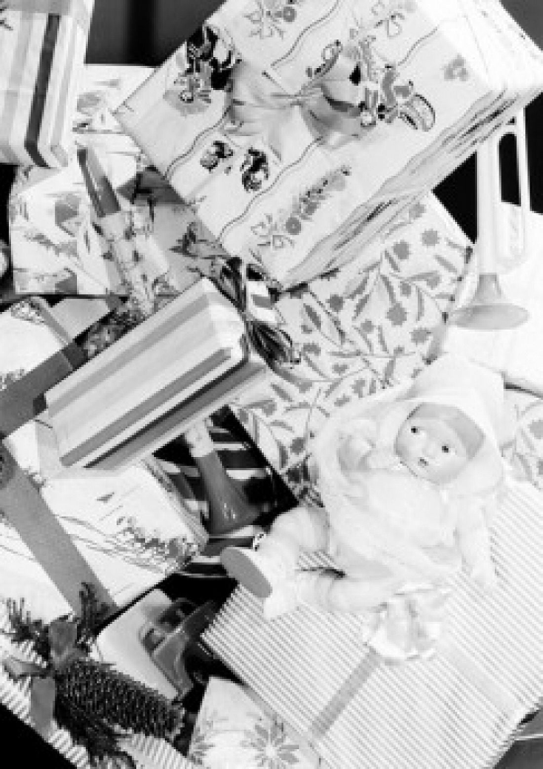 Doll lying on gift boxes Canvas Art - (18 x 24)