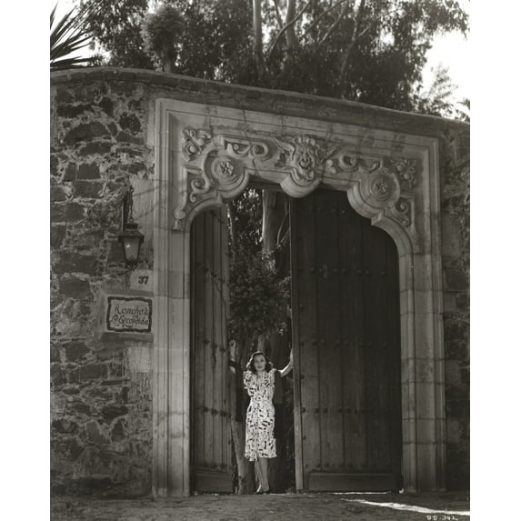 Dolores Del Rio Posed on a Big Door in Black and White Photo Print (24 x 30)