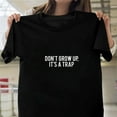 thumbnail image 1 of Don't Grow Up It's A Trap Funny Sarcastic Humor Quote Unisex T-Shirt, up to size 5XL - Last-Minute Gift, 1 of 2