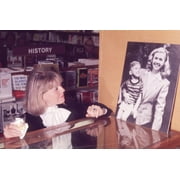 Doris Day gazing at picture of herself holding her son, Terry Melcher, undated. Photo: Oscar Abolafia (DORISDAY16) Poster Print (8 x 10)