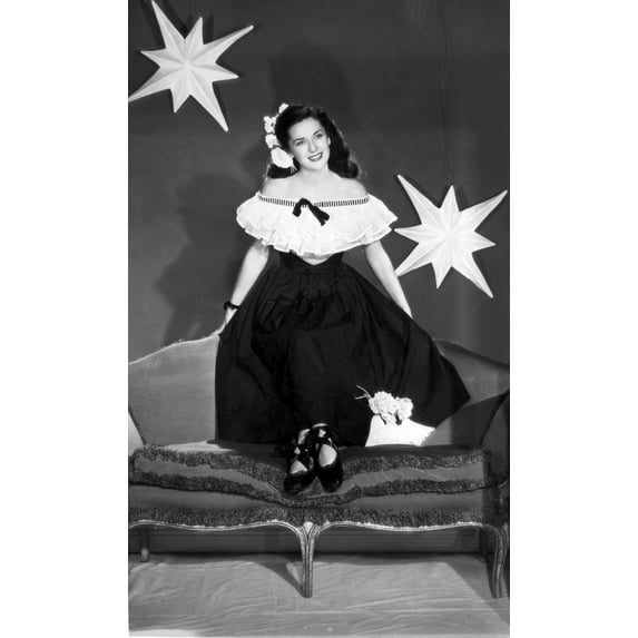Dorothy Ford on a Off-Shoulder Dress on a Couch Photo Print (8 x 10)
