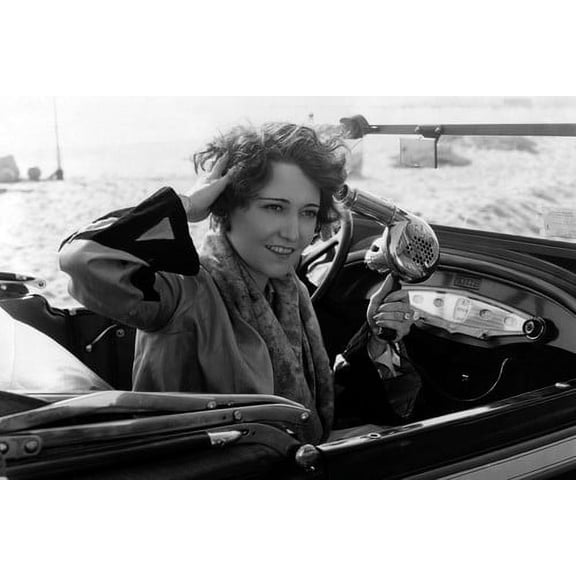 Dorothy Sebastian using hair dryer in convertible vintage car 24x36 Poster