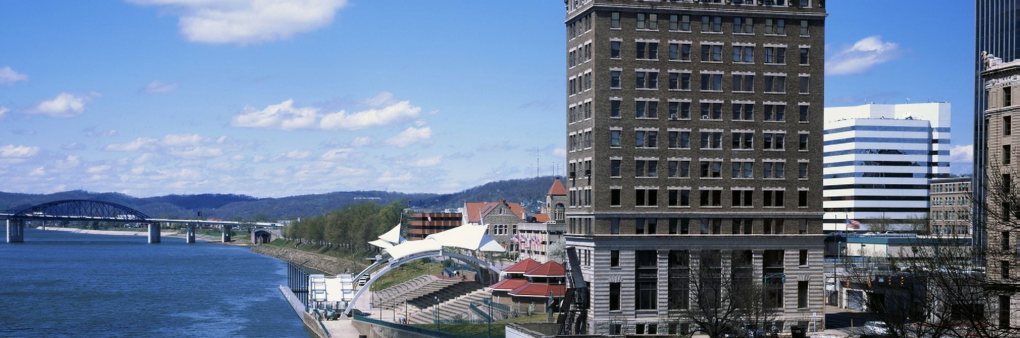Downtown buildings at waterfront Kanawha River Charleston Kanawha County West Virginia USA Canvas Art - Panoramic Images (36 x 12)